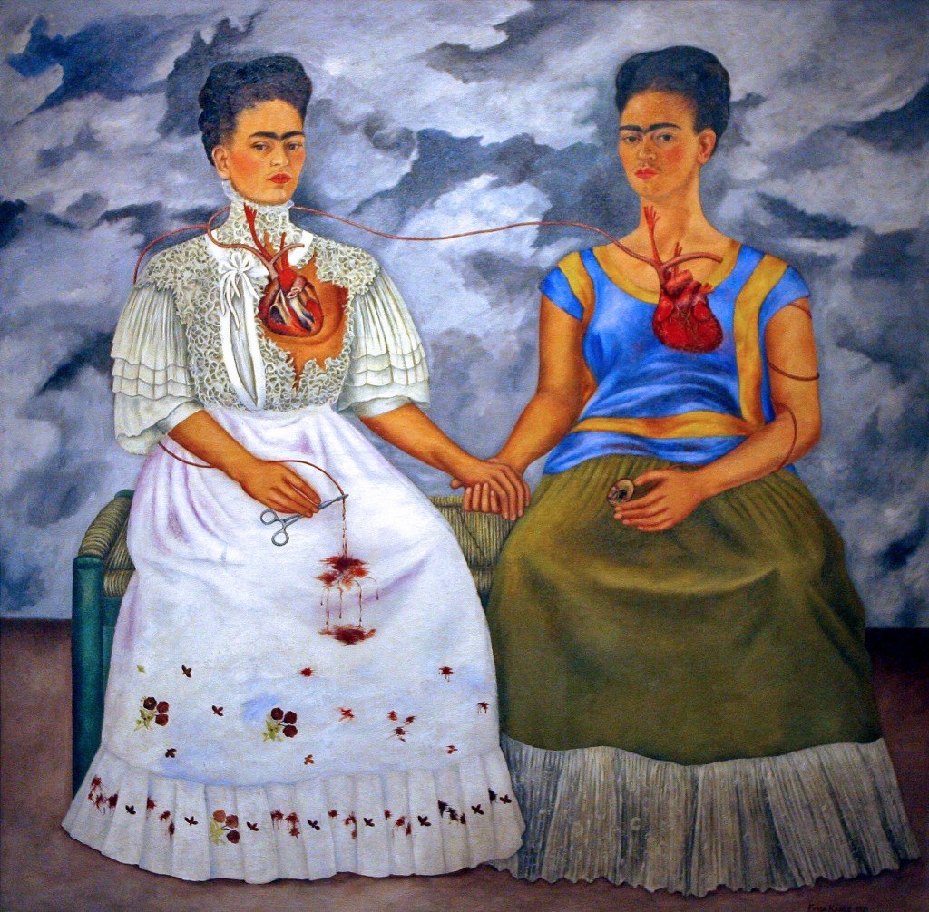 Detail of the oil "Las dos Fridas" (The Two Fridas) by Mexican artist Frida Khalo on display during an exhibition for the press 12 June 2007 in Mexico City.  Mexico City's Fine Arts Palace will open on Wednesday the exhibit "Frida Khalo 1907-2007 National Homage" to celebrate the 100th anniversary of the artist's birth.    AFP PHOTO/Luis ACOSTA MEXICO-ART-KHALO