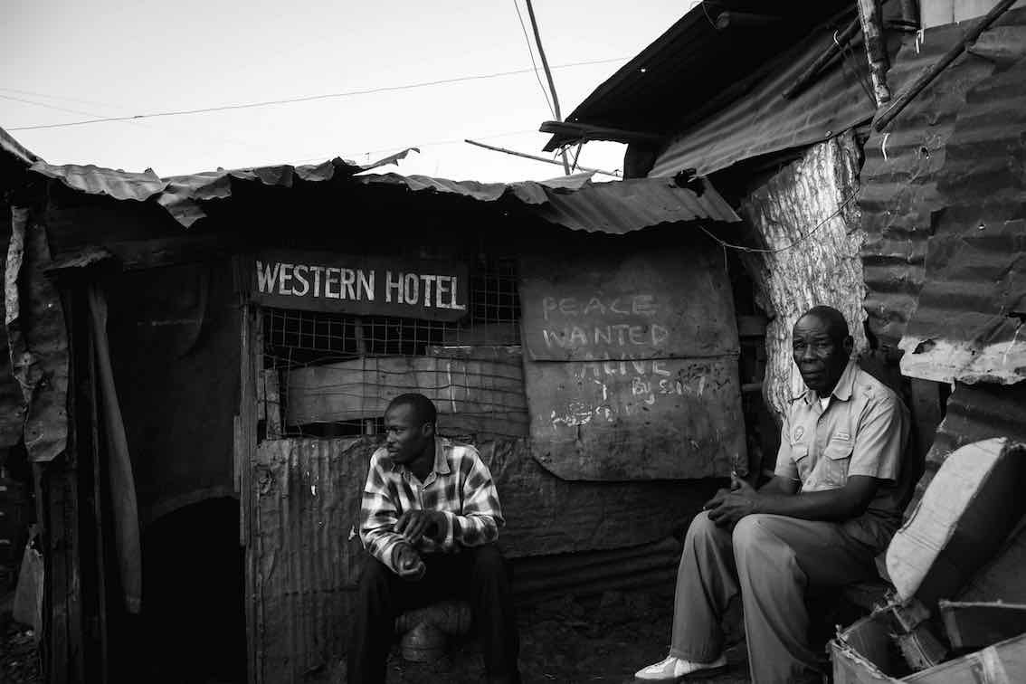 Solomon Muyundo A.k.a Solo7 originally from Kakamega Western Kenya. He moved to Kibera in December 2003. Four years later during the December 2007-2008 elections he decided to demonstrate in his own way with slogans like 'PEACE WANTED ALIVE' and 'KEEP PEACE FELLOW KENYANS' leaving the message all over the Kibera slum. His Solo7 signature comes from his first name and the fact that he was the seventh born in his family on July 7, 1977. He now gives art lessons in schools. His art is scented around social issues and gets inspiration from the slum life.